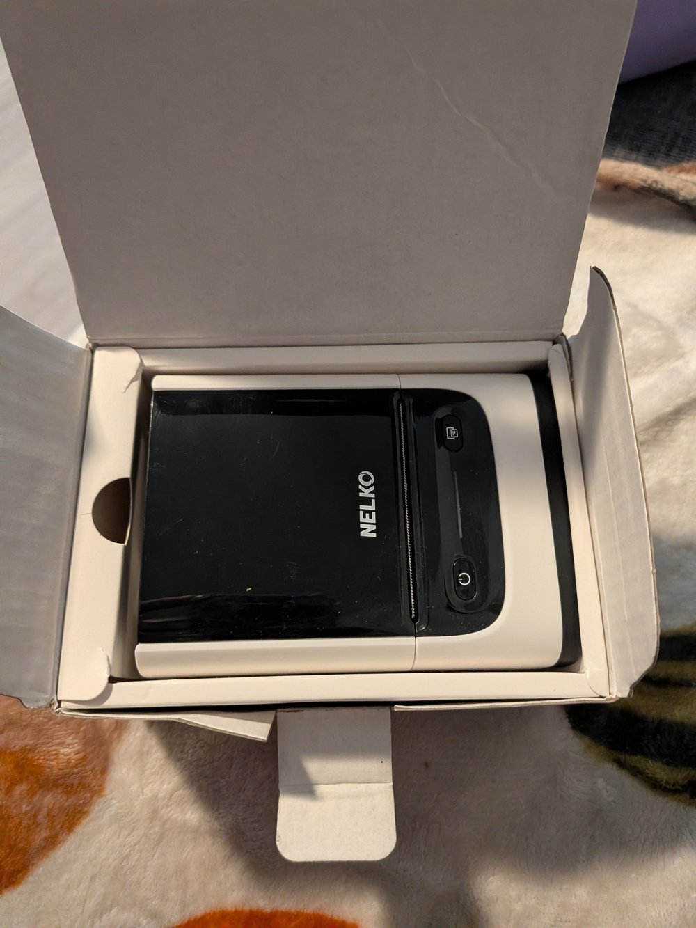 Nelko PM220 Bluetooth label printer is a compact, portable thermal device for ho